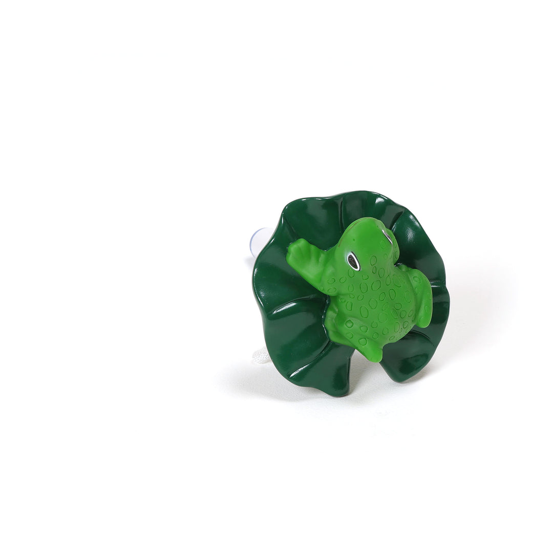 Ocean Blue floating frog pool thermometer in bright green sitting on a dark green lily pad with suction cup on white background