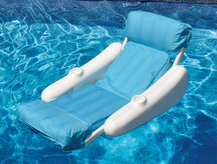Swimline Sunchaser Sunsoft Luxury Lounger floating in pool with light blue cushioned seat and backrest and white plastic armrests with cup holders