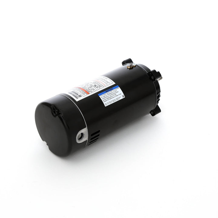 Century pool pump motor black cylindrical housing with threaded shaft and multiple information labels on side