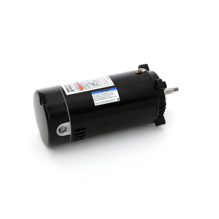 Century pool pump motor in black cylindrical shape with threaded metal shaft and warning label on side