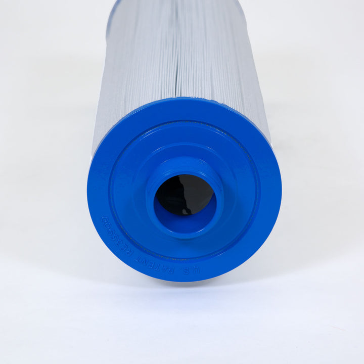 Close-up of a cylindrical replacement filter cartridge with white pleated filter material and blue plastic cone handle end with a threaded opening