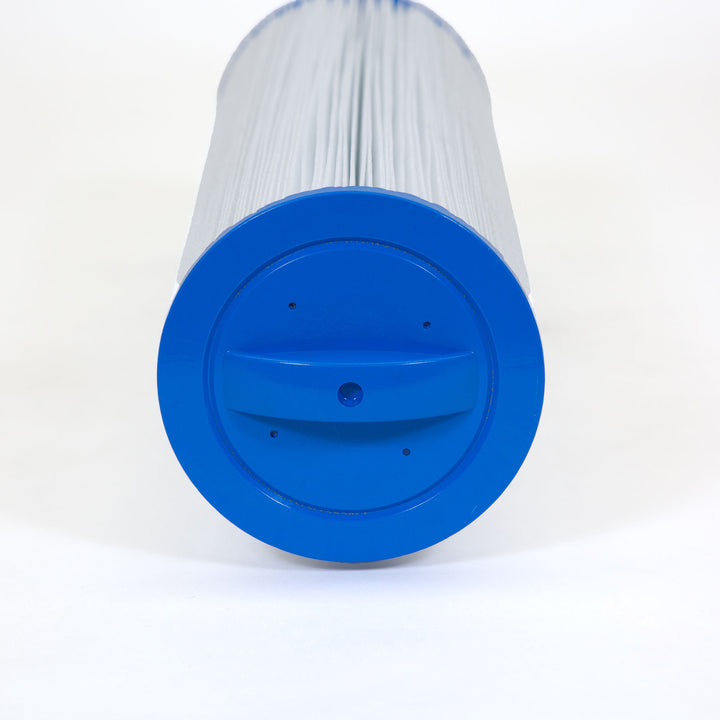 Cylindrical pool filter cartridge with pleated white paper and blue plastic end cap placed on white surface