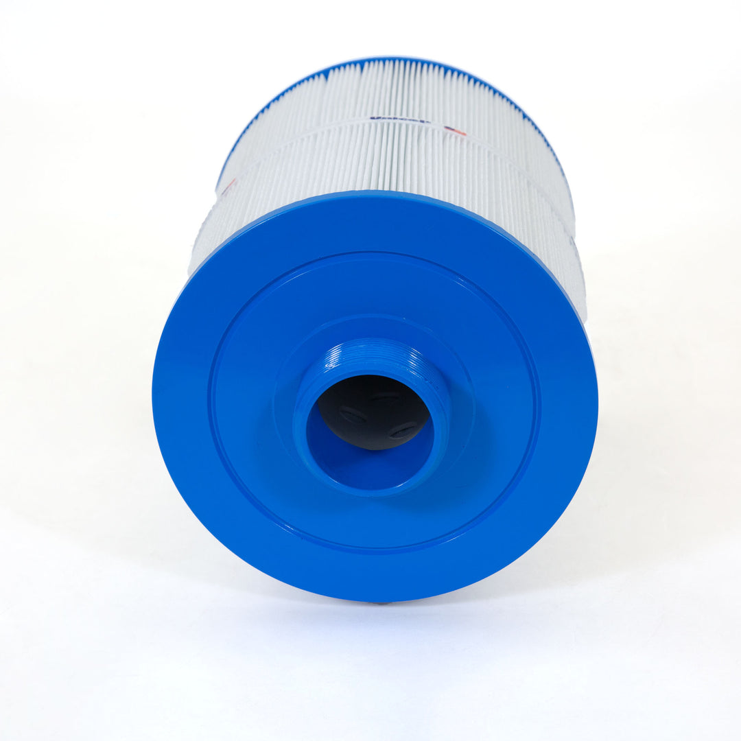 cylindrical replacement filter cartridge with pleated white material and blue plastic end caps lying on white surface