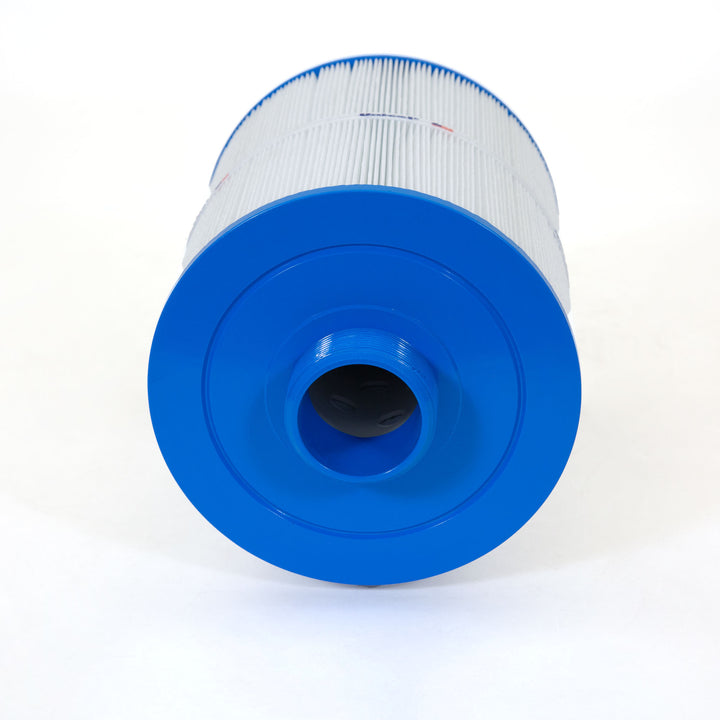 cylindrical replacement filter cartridge with pleated white material and blue plastic end caps lying on white surface