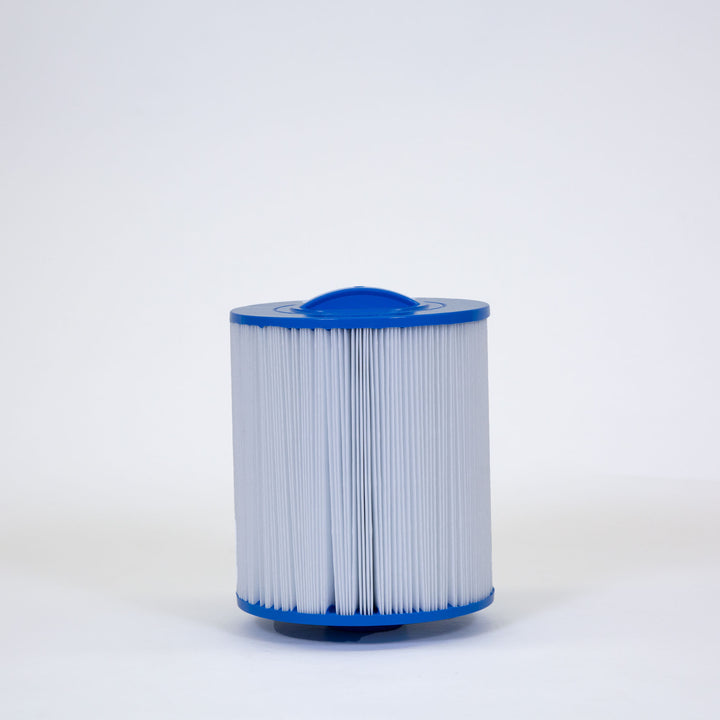 cylindrical replacement filter cartridge with blue plastic ends and white pleated filter material standing upright on white surface