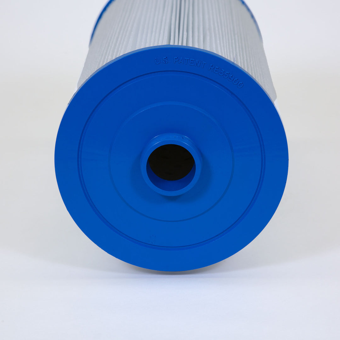 close-up of a cylindrical water filter cartridge with a blue plastic end showing a central hollow tube for water flow