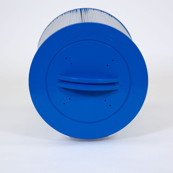 Cylindrical pool filter cartridge with white pleated filter material and a blue plastic top with a handle and off direction arrows