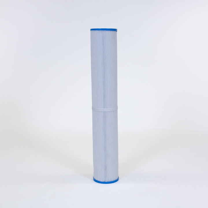 Tall cylindrical pool filter cartridge with white pleated material and blue caps on both ends standing upright on white surface
