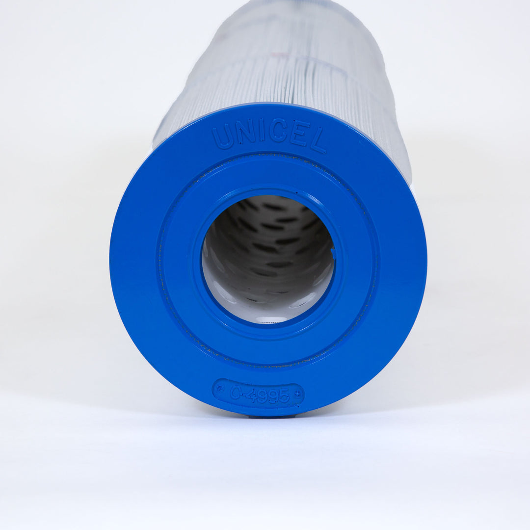 Cylindrical water filter cartridge with white pleated body and blue end cap labeled unicel and C-4995