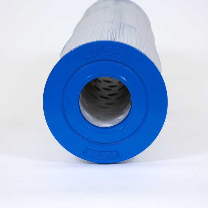 Cylindrical water filter cartridge with white pleated body and blue end cap labeled unicel and C-4995
