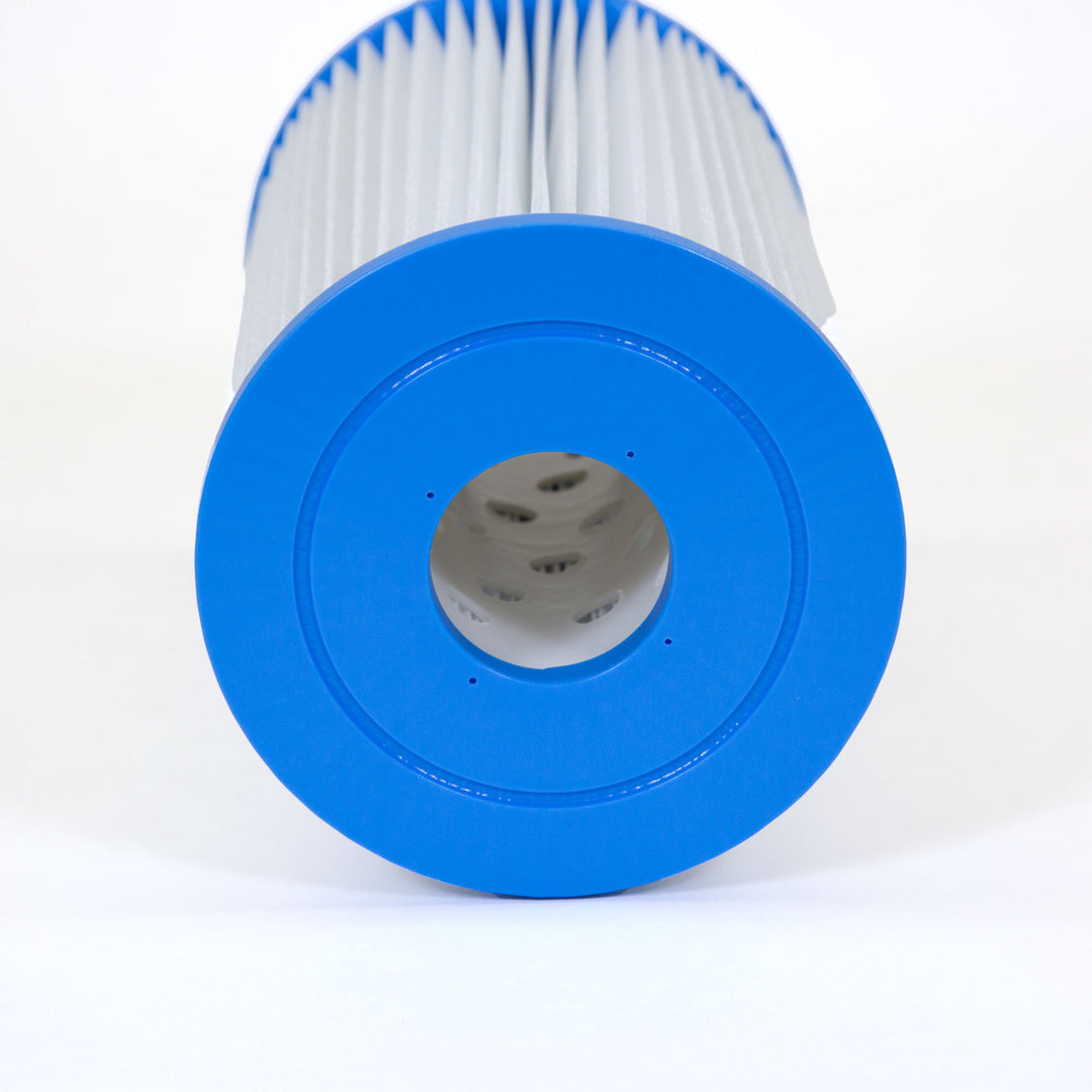 cylindrical pool filter cartridge with white pleated material and blue plastic end caps shown from the top opening