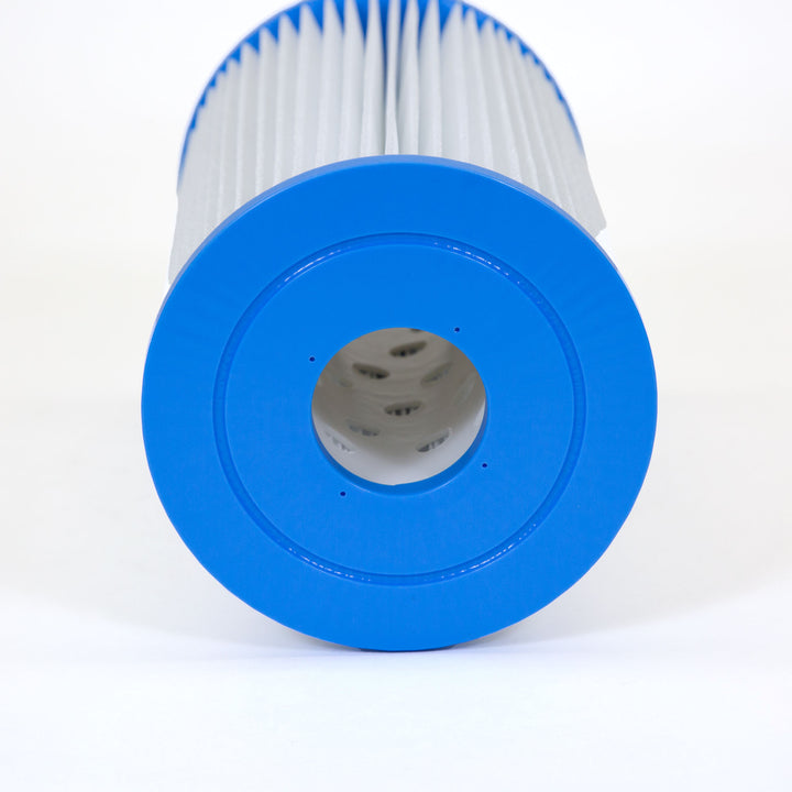 cylindrical pool filter cartridge with white pleated material and blue plastic end caps shown from the top opening
