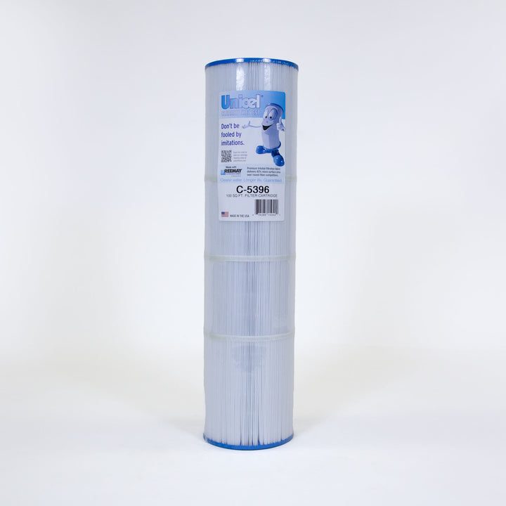 Tall cylindrical pleated white pool or spa filter cartridge with blue edges and a label featuring text and a cartoon character