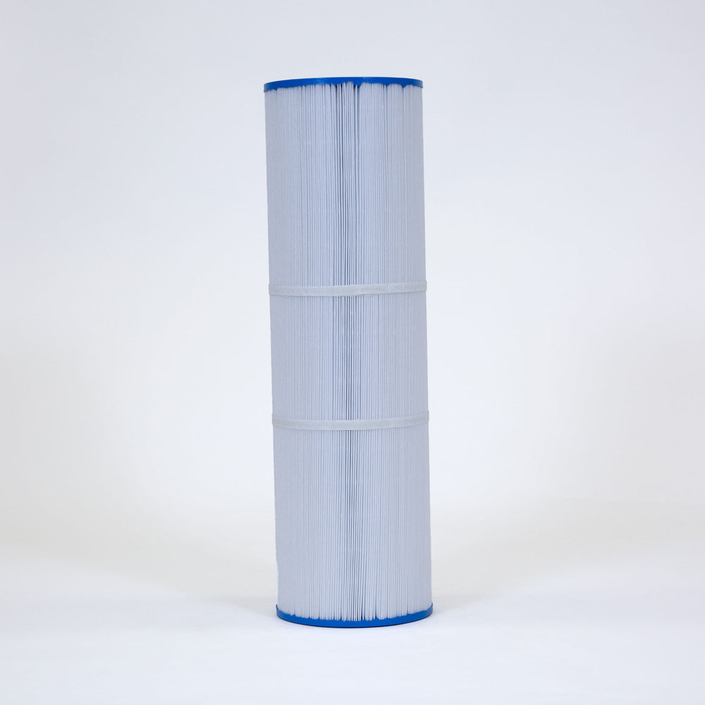 Tall cylindrical replacement filter cartridge with pleated white material and blue flat end caps standing upright on white surface