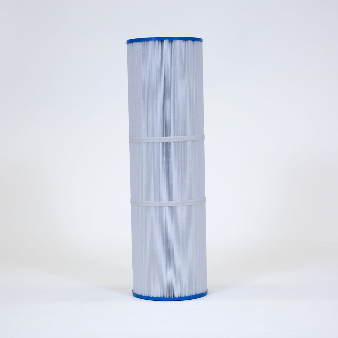 Tall cylindrical replacement filter cartridge with pleated white material and blue flat end caps standing upright on white surface