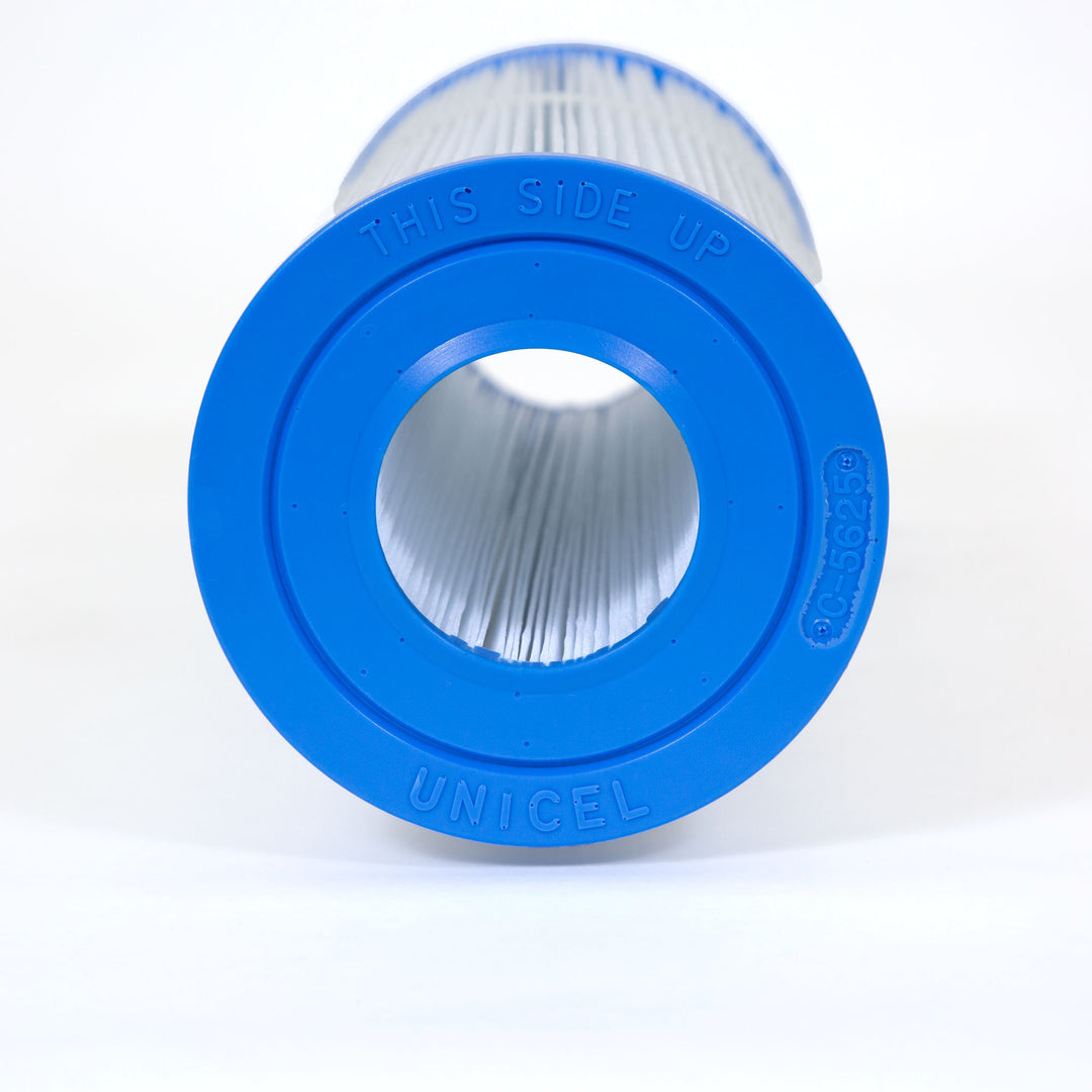 Close-up view of a cylindrical pool filter cartridge with blue end caps and pleated white filter material inside