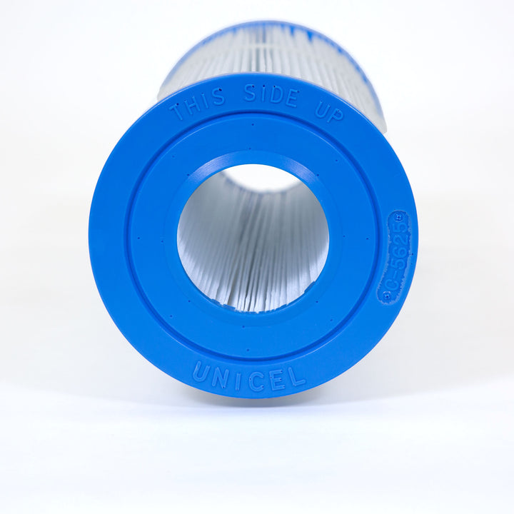 Close-up view of a cylindrical pool filter cartridge with blue end caps and pleated white filter material inside