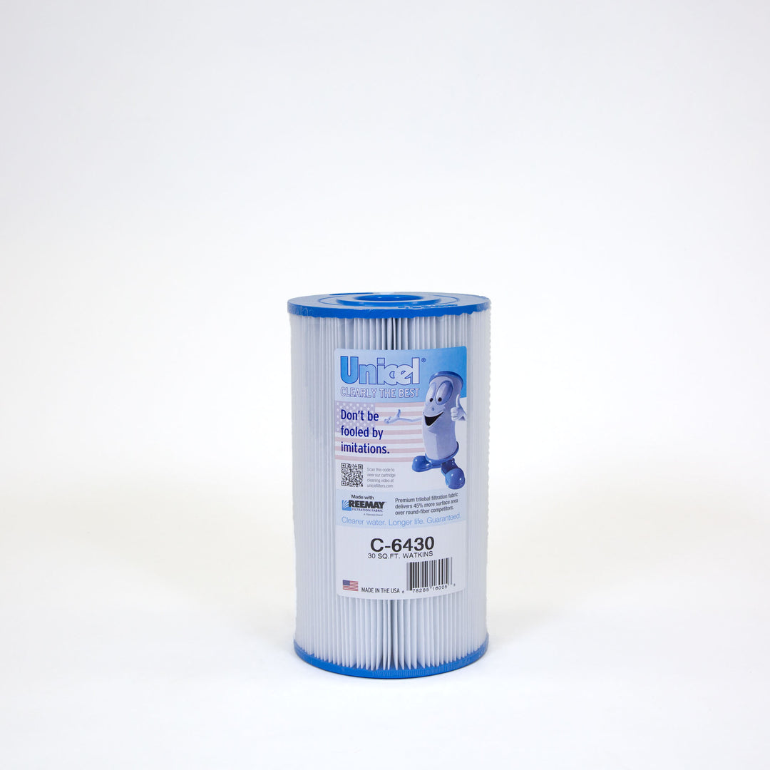 Cylindrical white pleated pool filter cartridge with blue end caps and a label featuring a cartoon character and product information