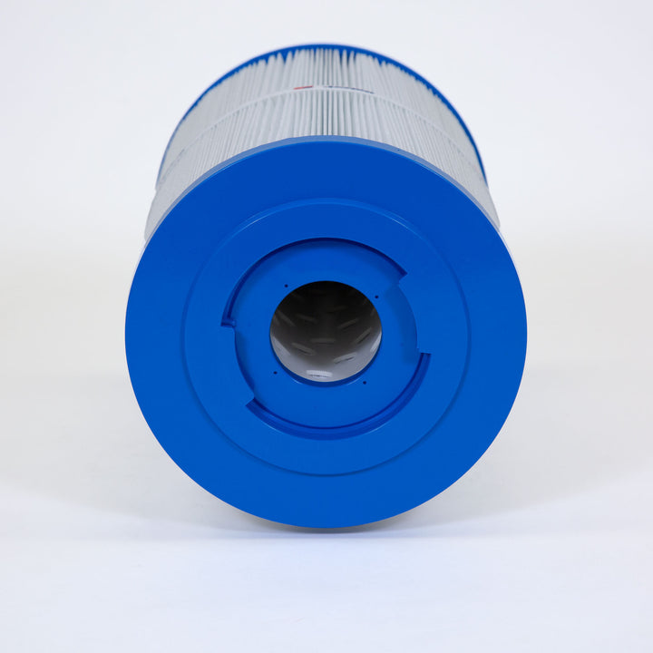 cylindrical spa filter cartridge with blue end caps and pleated white filtering material resting horizontally