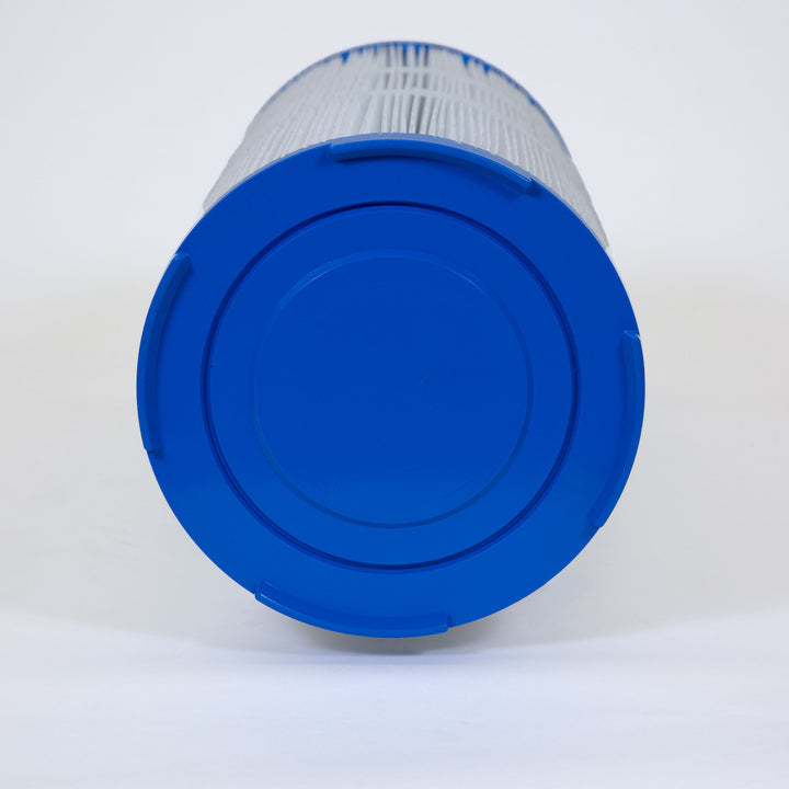 Cylindrical pool spa filter cartridge with blue plastic end caps and white pleated filter material wrapped around the sides