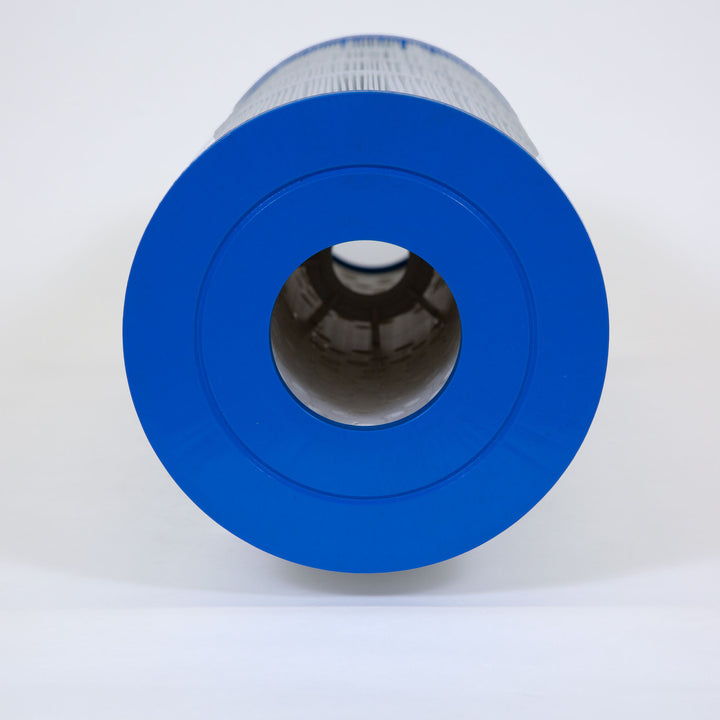 close-up view of the blue circular end of a white cylindrical filter cartridge with a hollow center opening