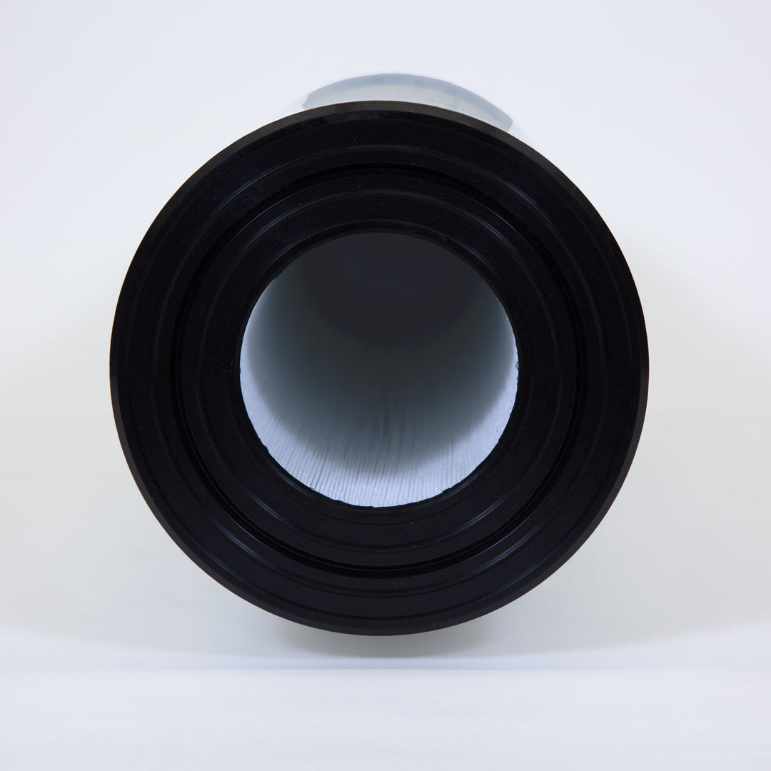 Close-up front view of cylindrical pool filter cartridge with black plastic opening and white pleated interior material