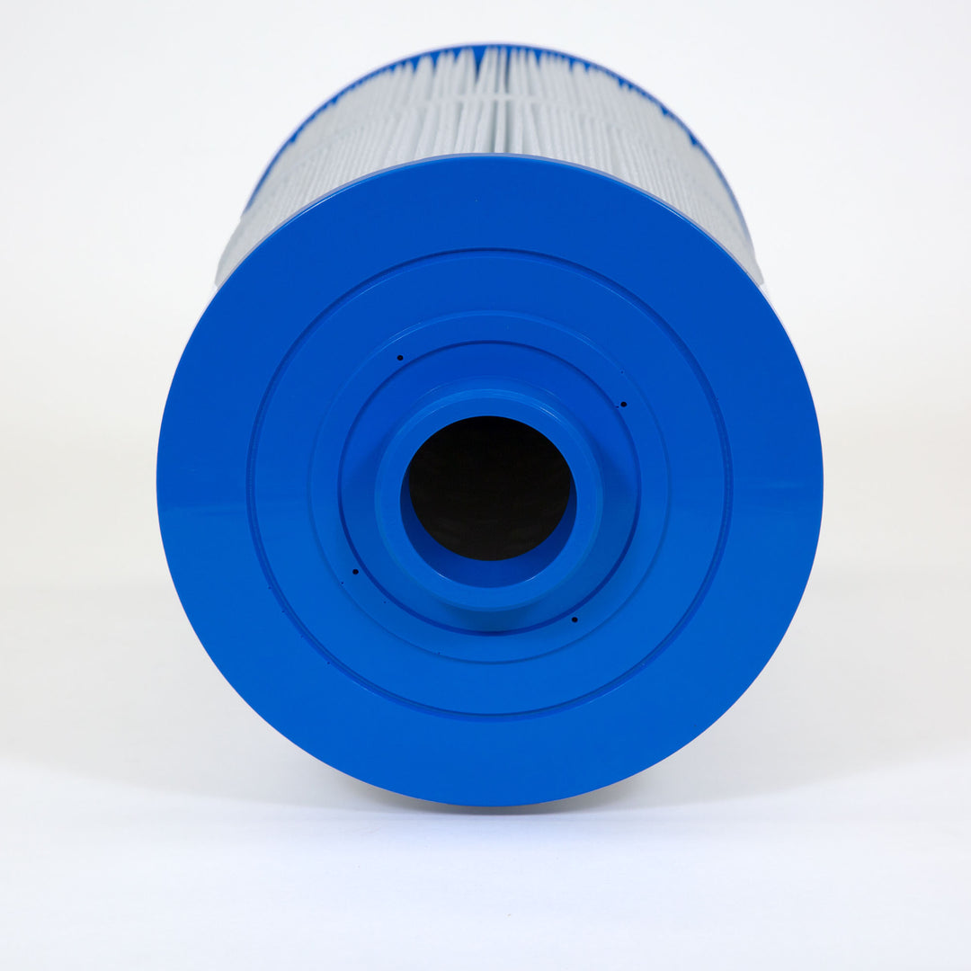close-up of a blue cylindrical replacement filter cartridge with pleated white filter material on a white background