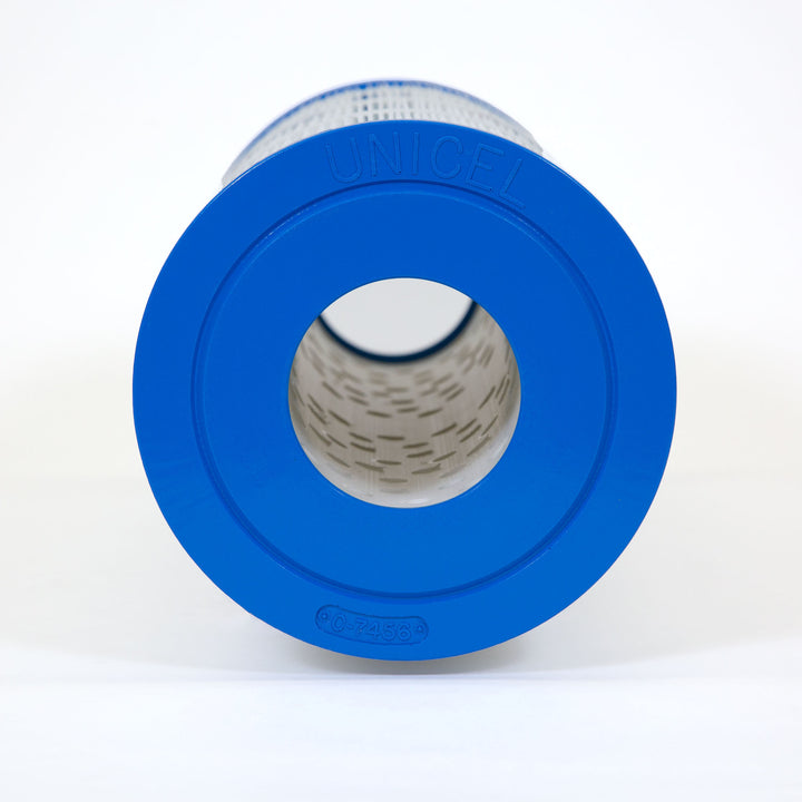 cylindrical pool filter cartridge with blue end caps and white pleated filter material labeled unicel c-7456