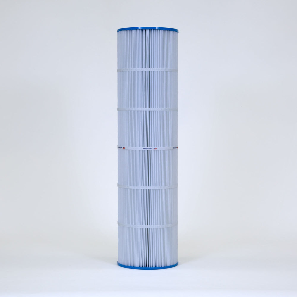 tall cylindrical pool filter cartridge with white pleated material and blue top and bottom edges standing upright on plain background