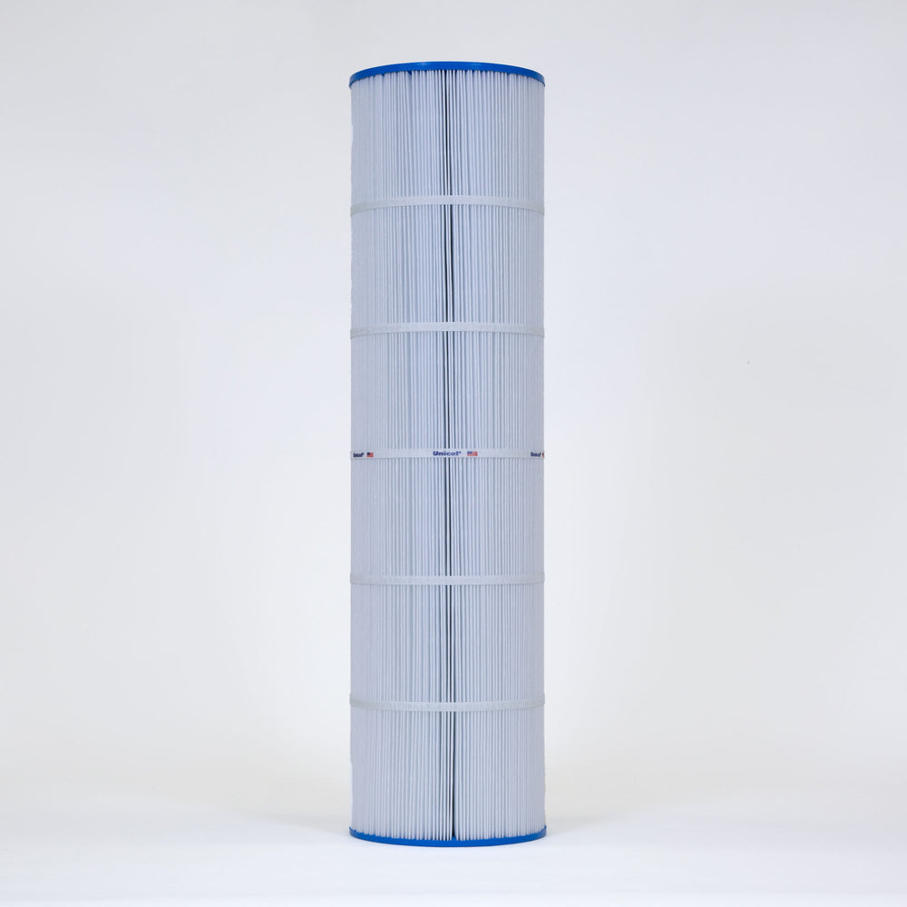 Tall cylindrical pool filter cartridge with white pleated material and blue caps on top and bottom standing upright on a plain background