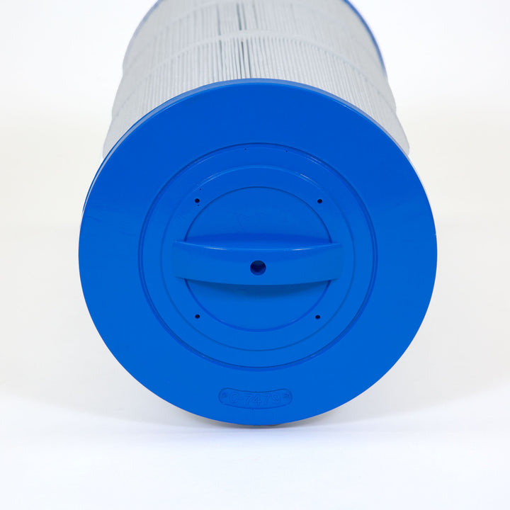 Close-up view of a cylindrical pool filter cartridge with white pleated filter material and a bright blue end cap featuring a ridged handle