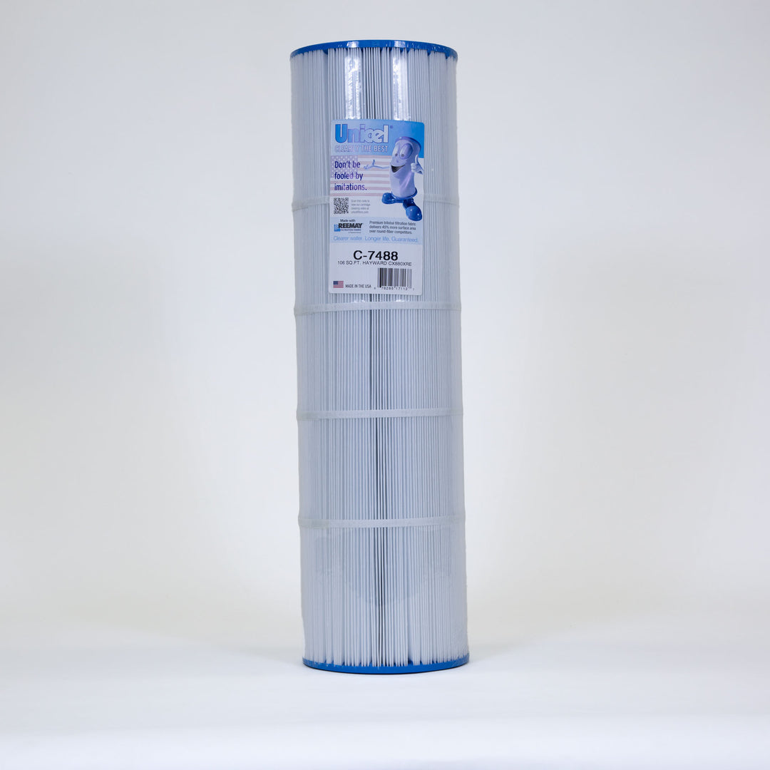 Tall cylindrical pool filter cartridge with white pleated filter material and blue ends standing upright on a white background