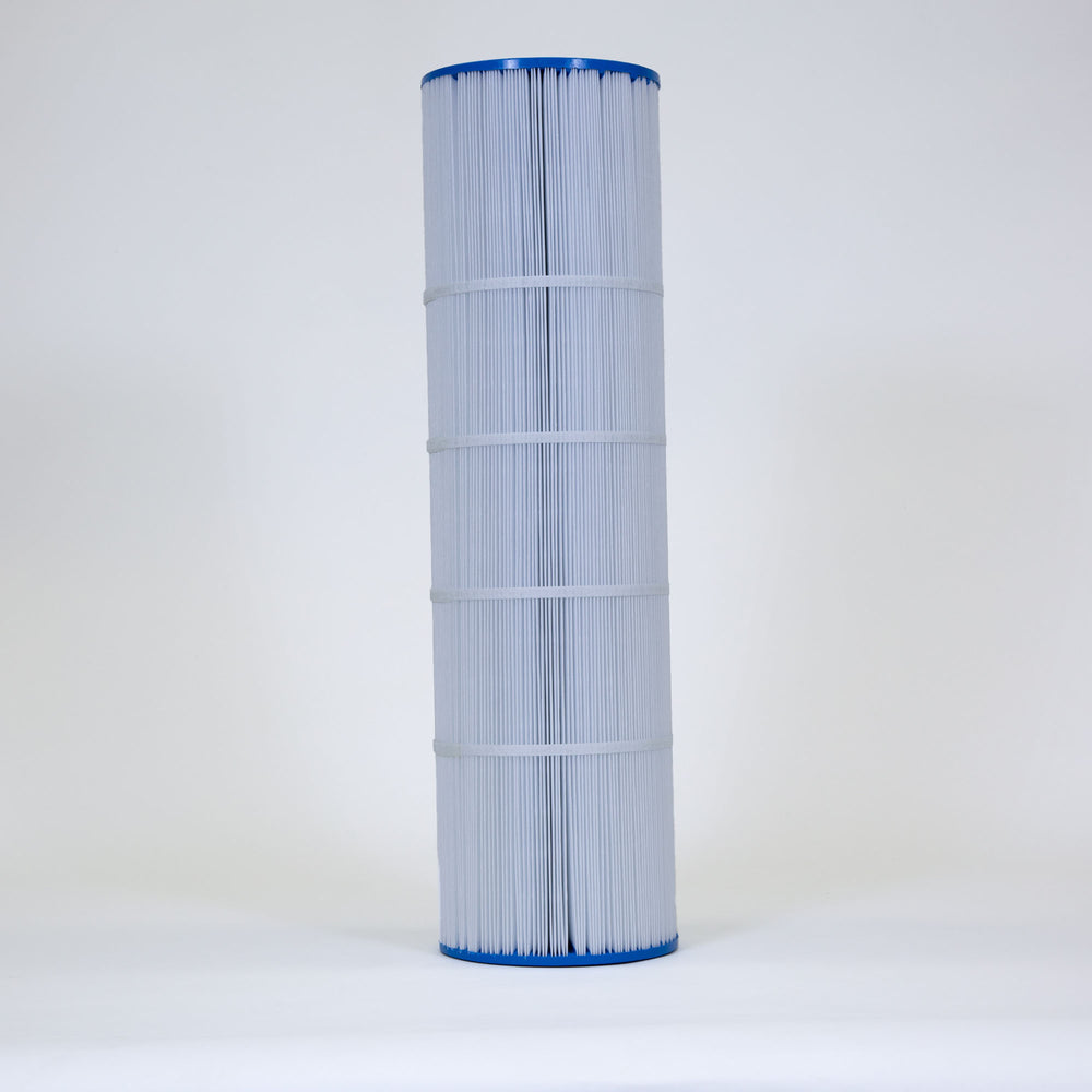 Tall cylindrical pool filter cartridge with white pleated fabric and blue plastic ends standing upright on a plain white surface