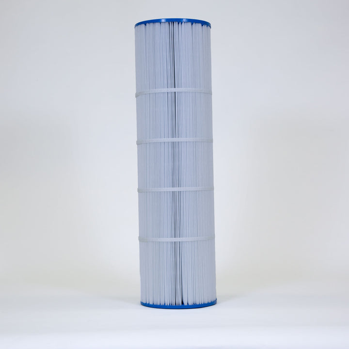 Tall cylindrical pool filter cartridge with white pleated fabric and blue plastic ends standing upright on a plain white surface