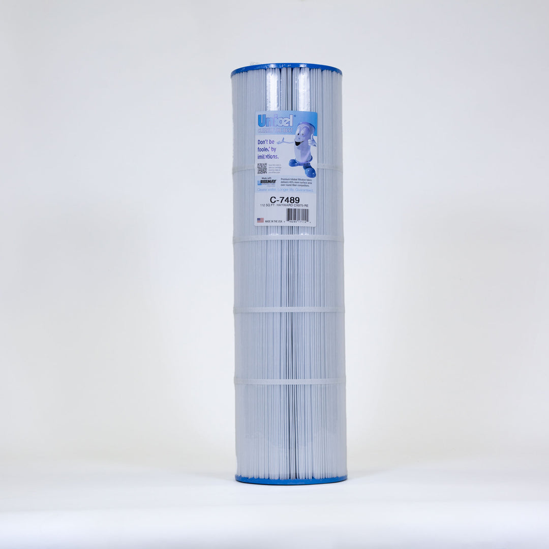 Tall cylindrical pool filter cartridge with blue plastic end caps and pleated white filtration fabric with a label on the top section