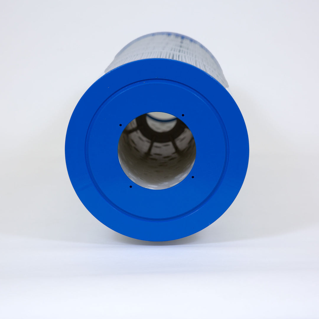 Cylindrical pool filter cartridge with blue end caps and pleated white filtering material viewed from the top