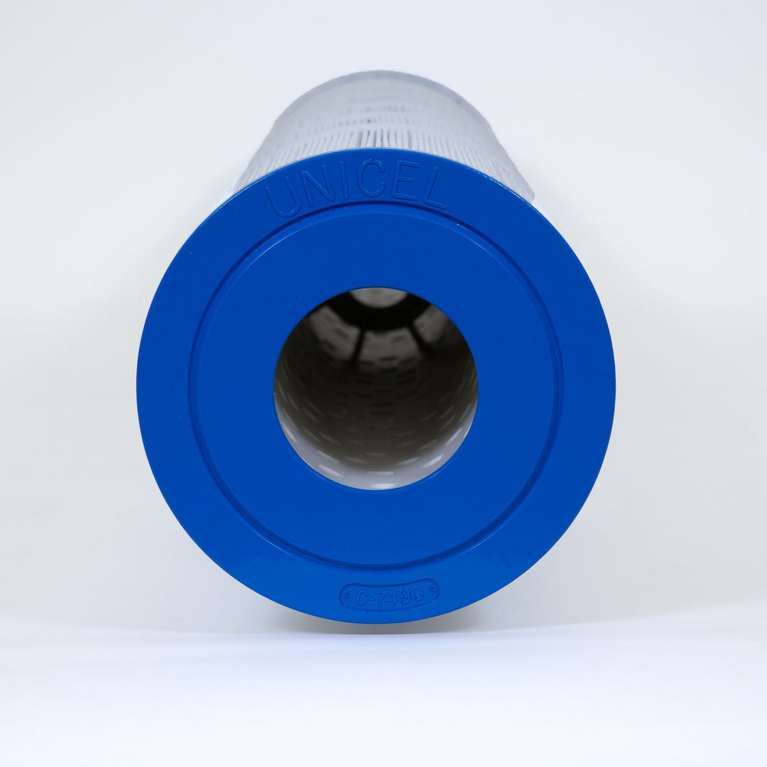 Cylindrical replacement filter cartridge with blue end cap marked UNICEL and model number C-7490 on a white background