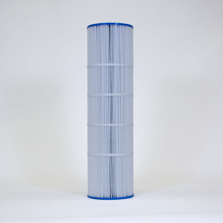 Tall cylindrical pool filter cartridge with white pleated material and blue end caps on plain background