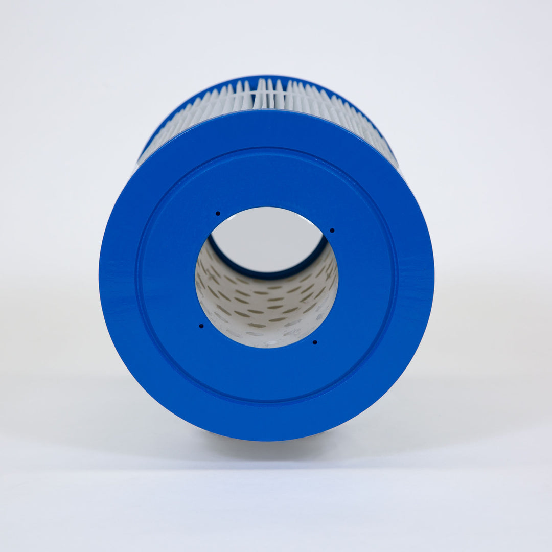 cylindrical filter cartridge with blue end caps and pleated white filtration material viewed from the side showing hollow core