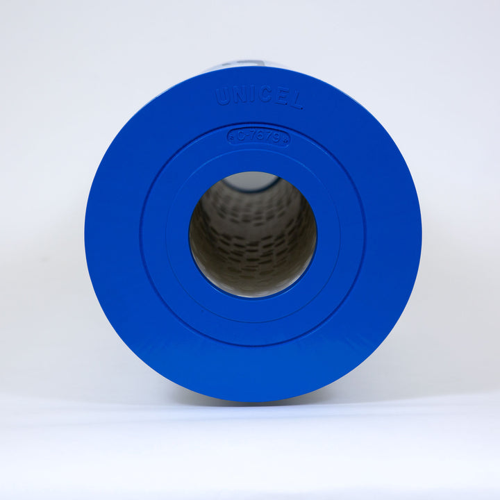 cylindrical blue filter cartridge standing upright on white surface with Unicel and C-7679 markings visible