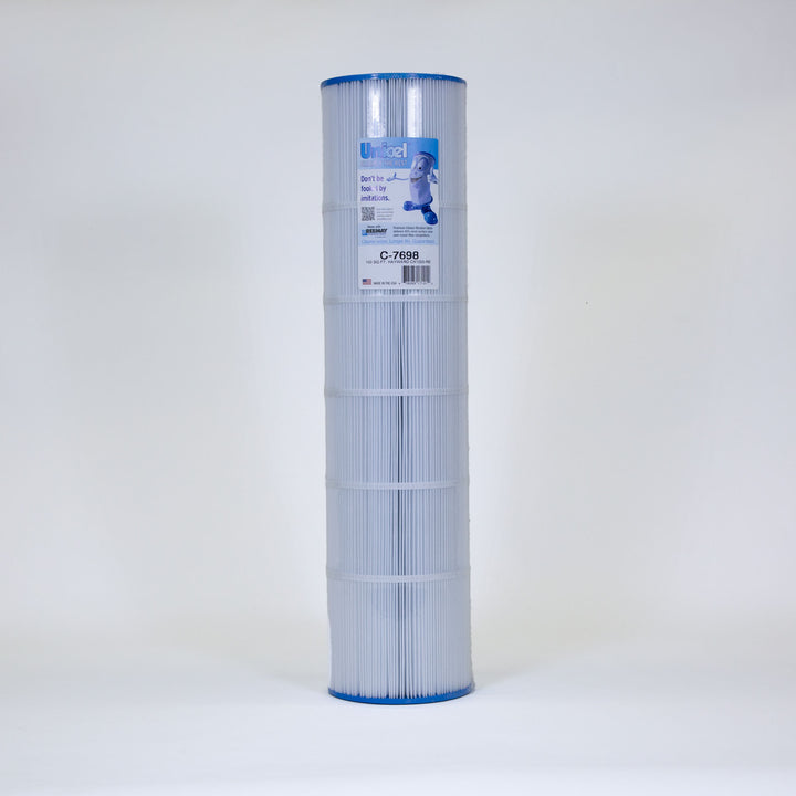 Tall cylindrical pool filter cartridge with white pleated material and blue caps on top and bottom standing upright