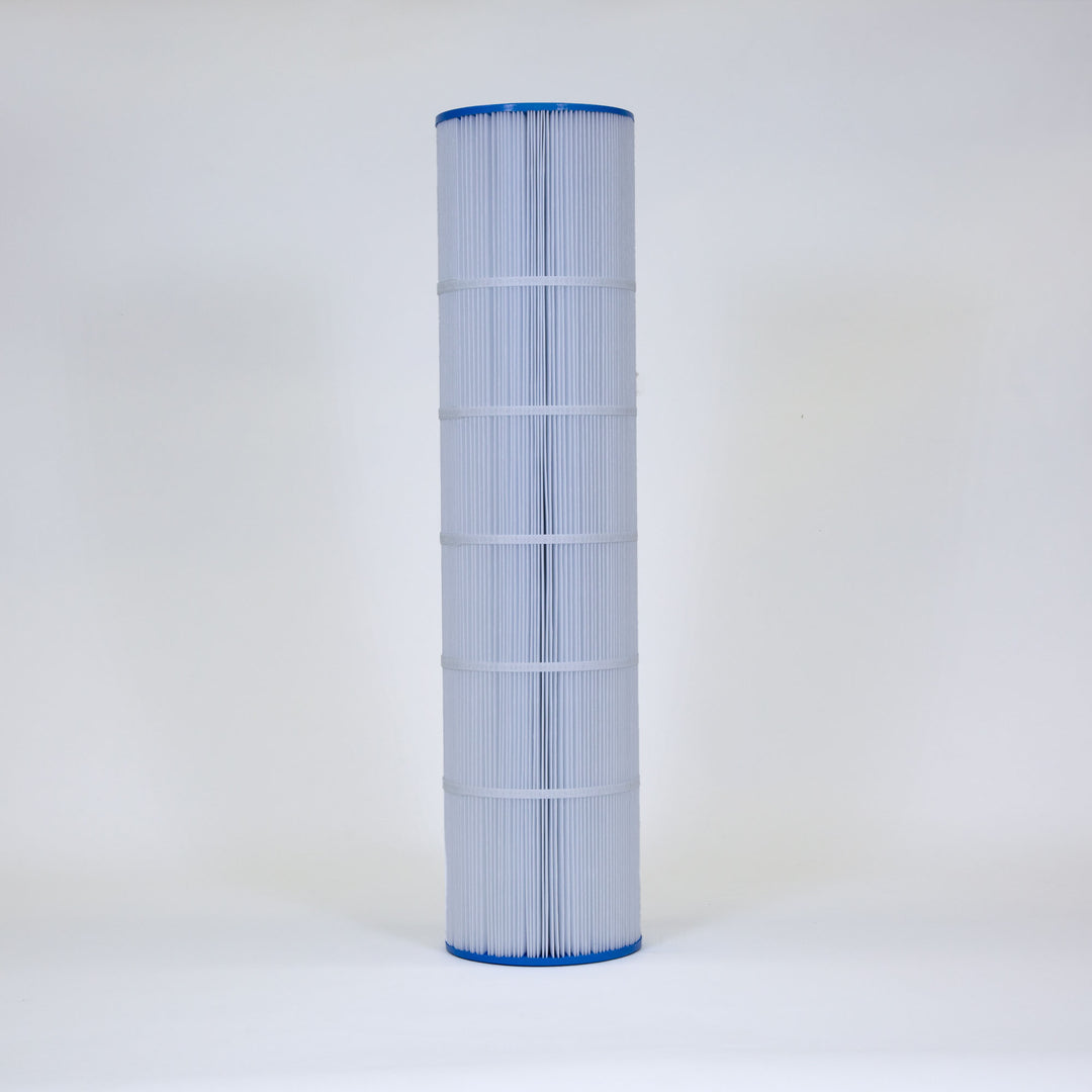 Tall cylindrical pool filter cartridge with white pleated fabric and blue plastic ends standing upright on a plain white background