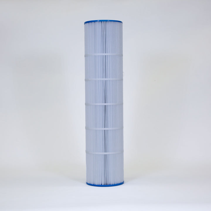 Tall cylindrical pool filter cartridge with white pleated fabric and blue plastic ends standing upright on a plain white background