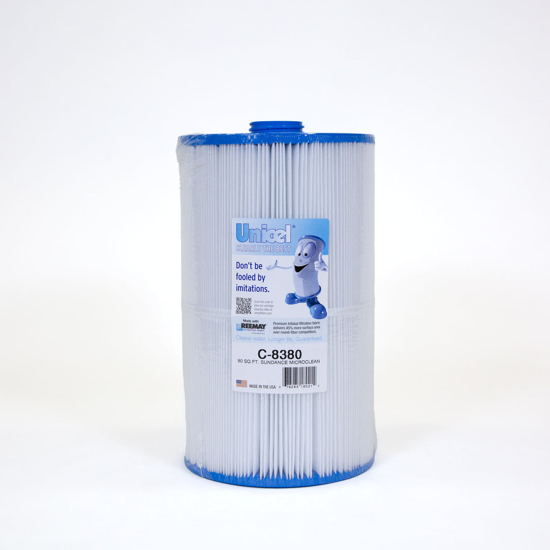 cylindrical pleated pool filter cartridge with blue plastic top and bottom and a label featuring a cartoon character giving thumbs up