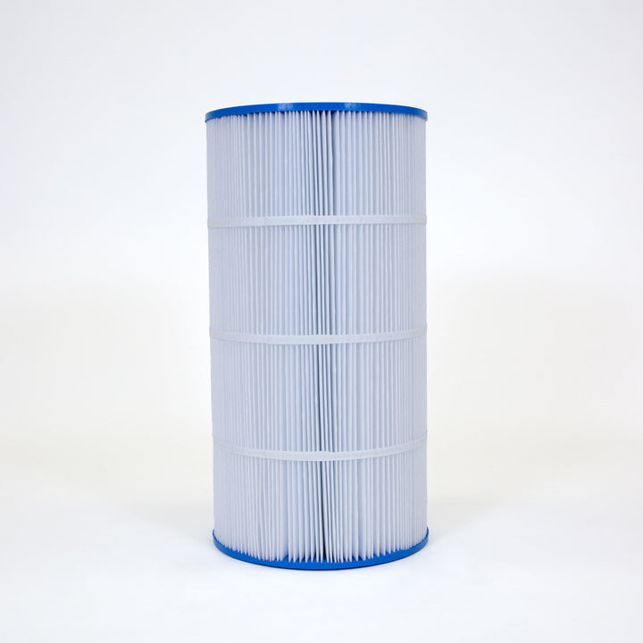 Tall cylindrical water filter cartridge with white pleated material and blue rims on top and bottom standing on white background
