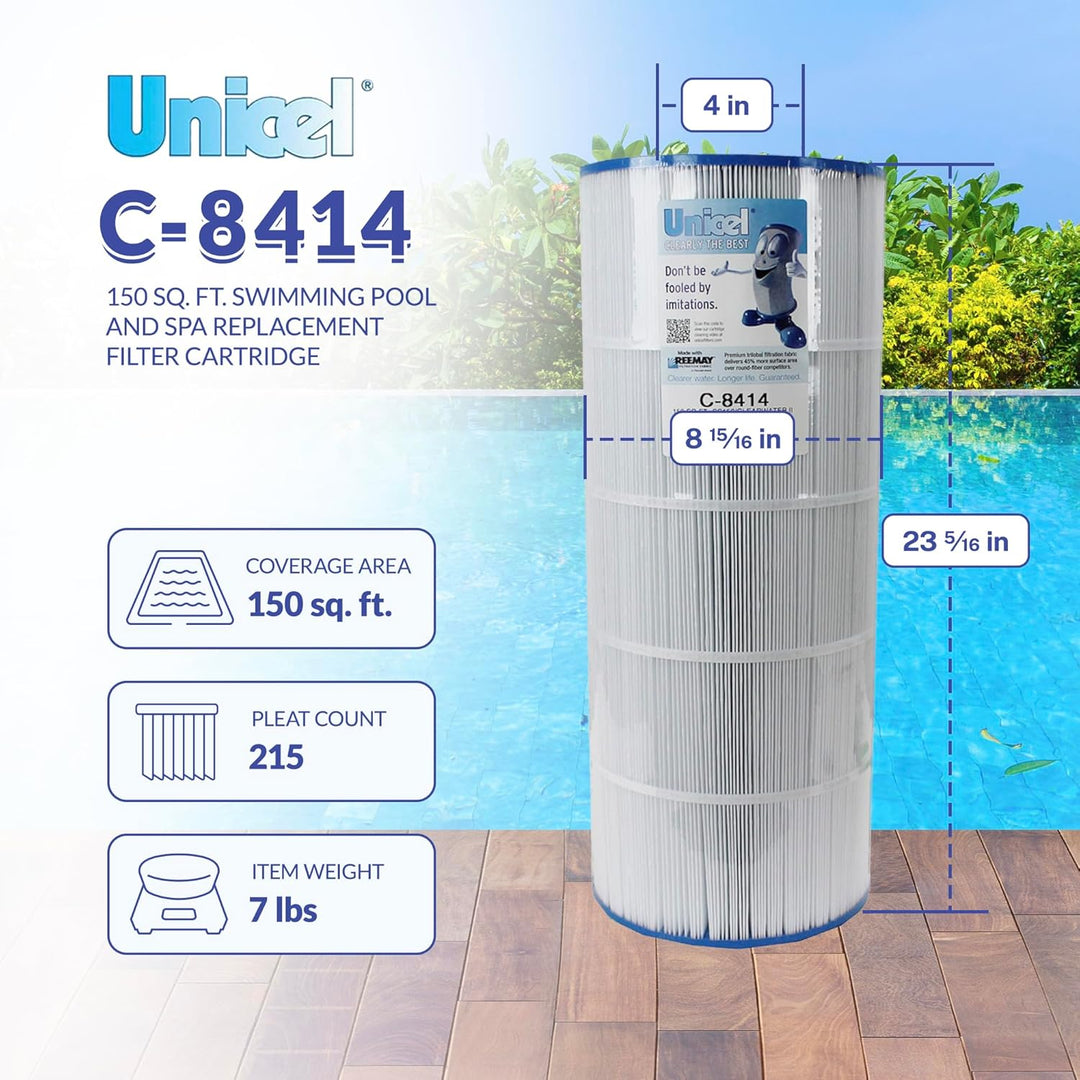 tall cylindrical white pleated filter cartridge with blue end caps standing on wooden deck by a blue swimming pool with green foliage background