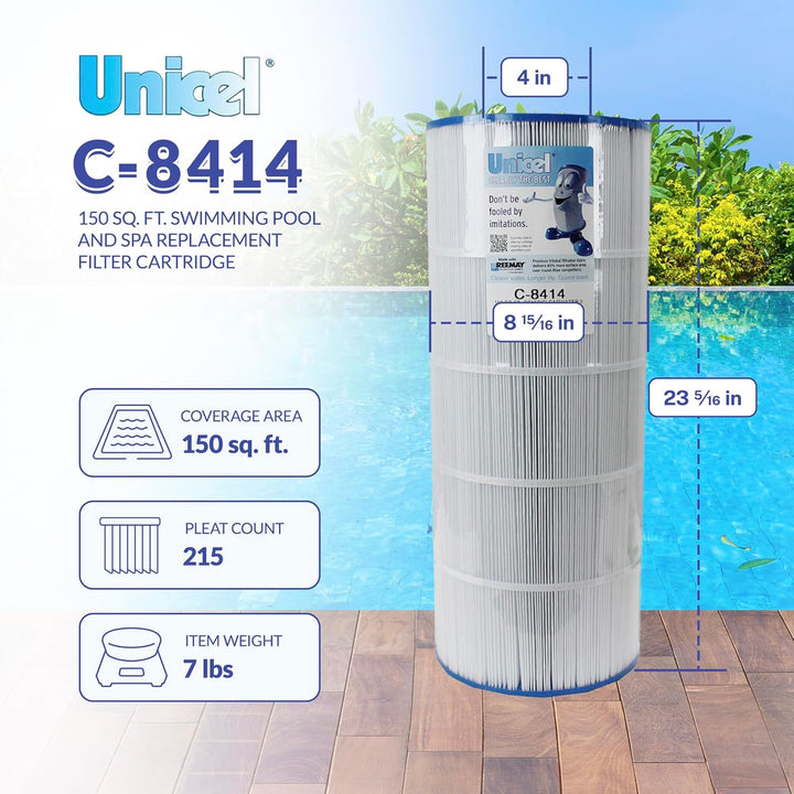 tall cylindrical white pleated filter cartridge with blue end caps standing on wooden deck by a blue swimming pool with green foliage background