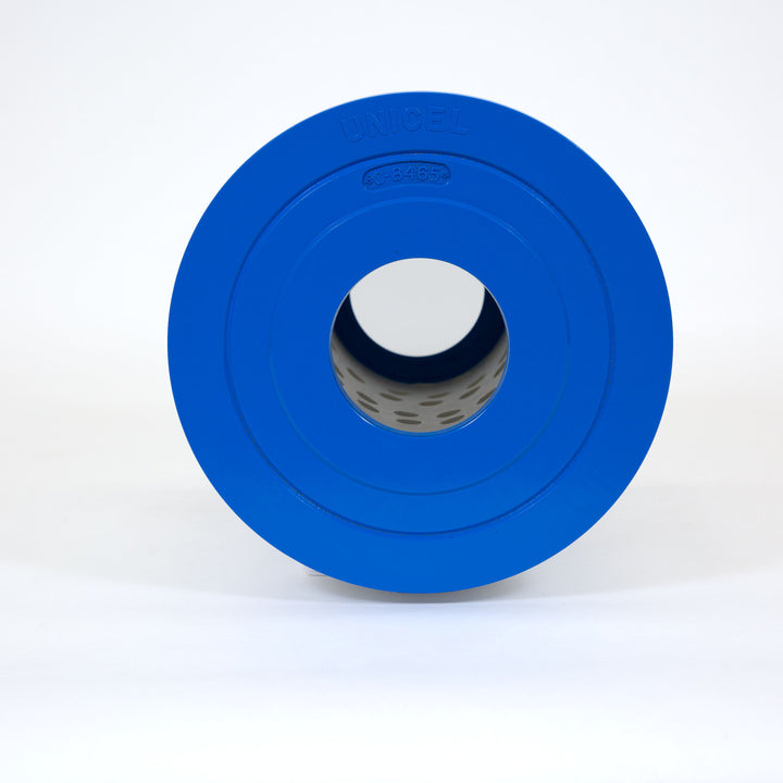 Close-up of a blue round spa filter cartridge with a hole in the center and perforated inner lining on white background
