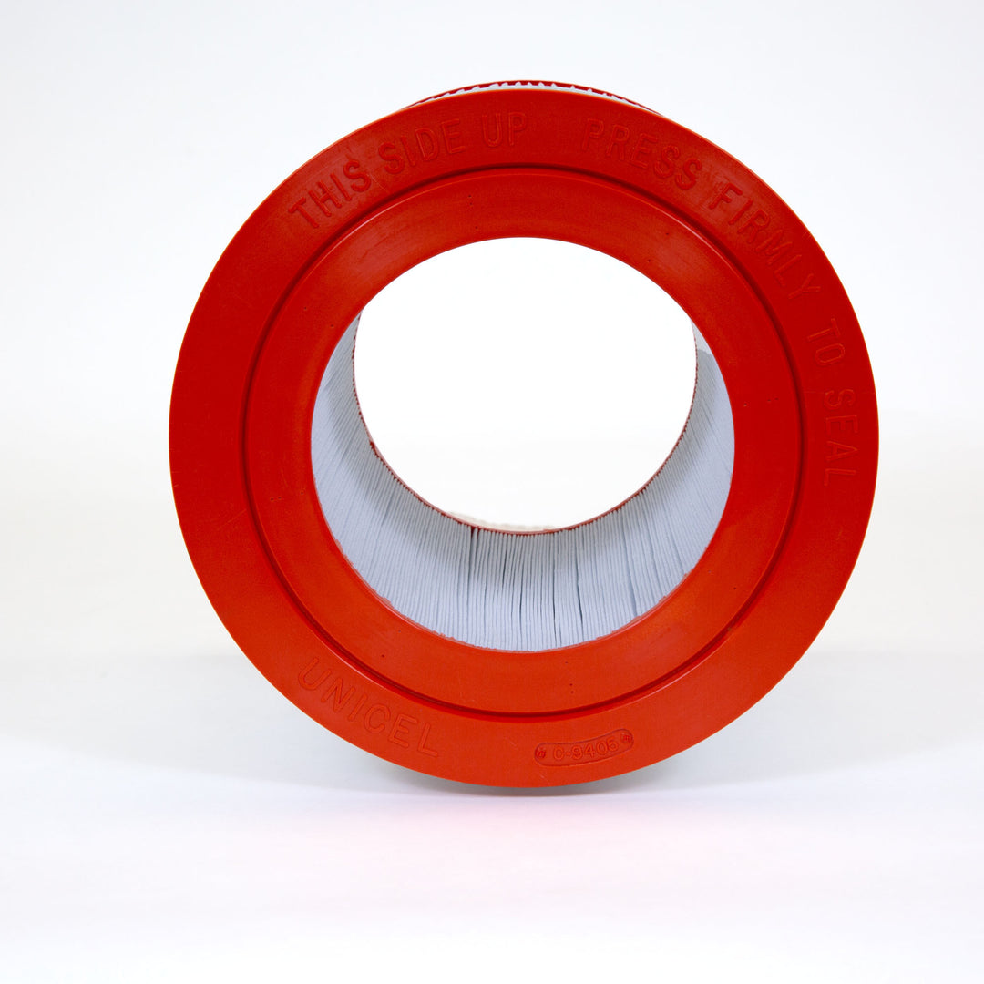 cylindrical pool filter cartridge with white pleated material and bright orange circular end caps against white background