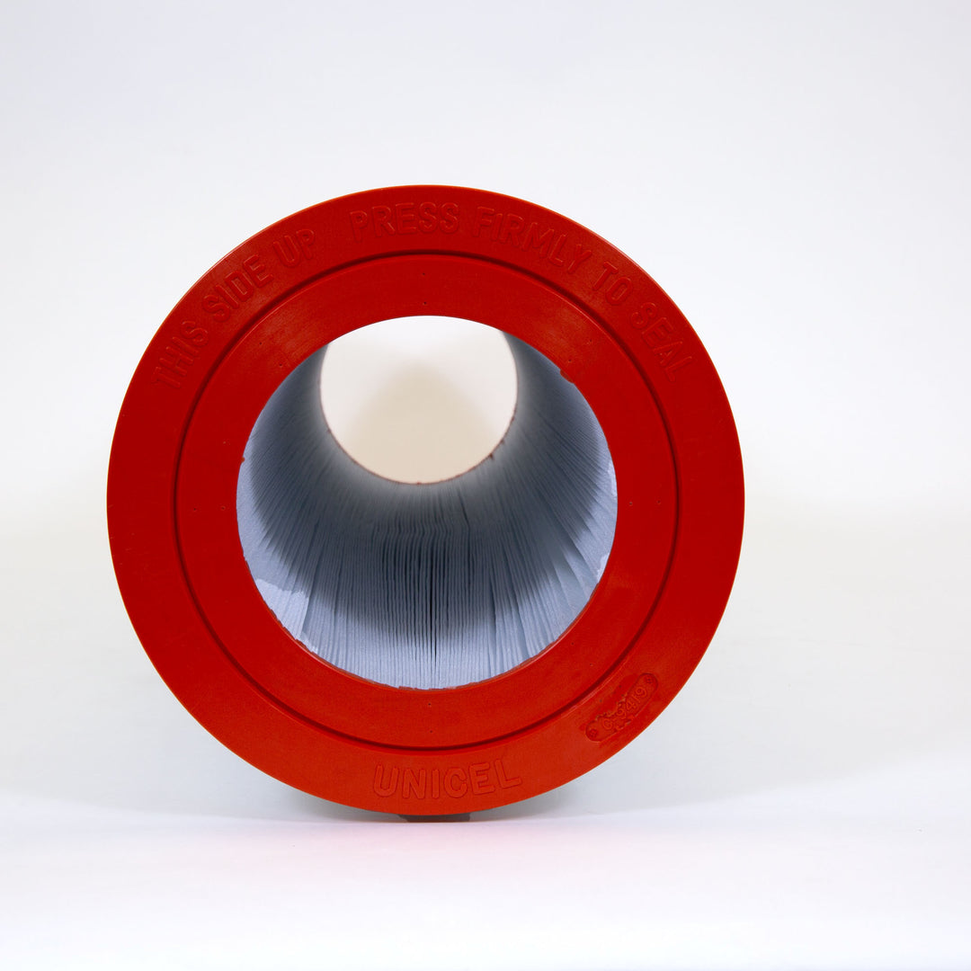 cylindrical replacement filter cartridge with red end caps and pleated blue filter material inside